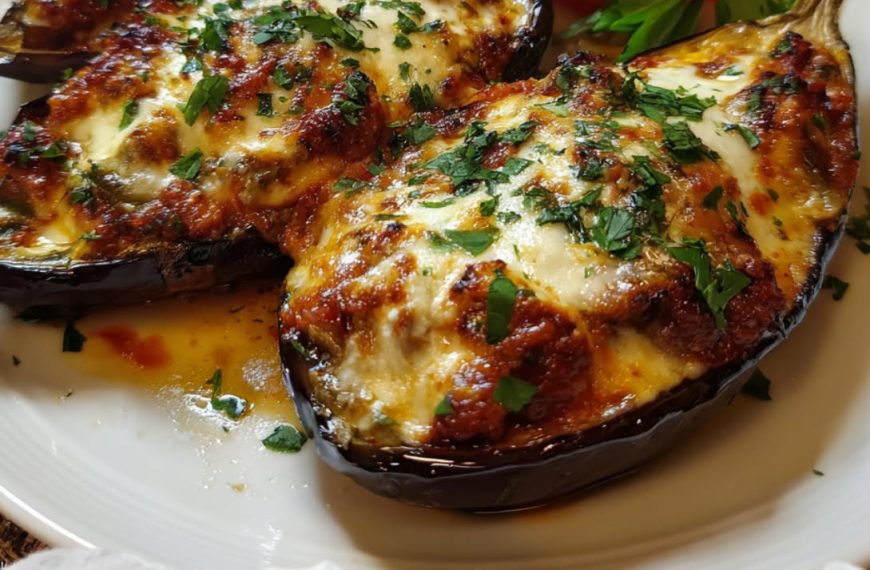 Papoutsakia (Greek Stuffed Eggplant with Seasoned Beef, Creamy Béchamel, and Golden Cheese)